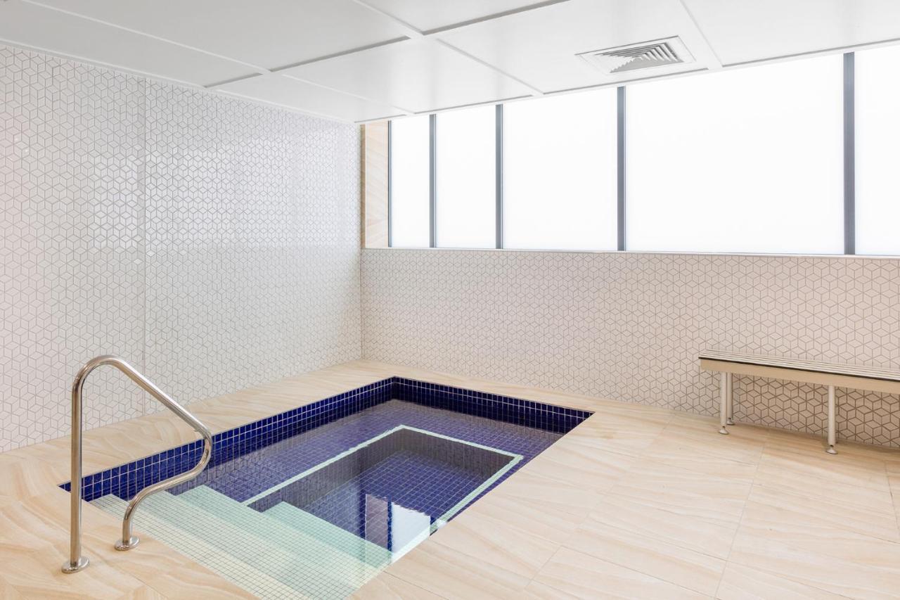 Meriton Suites Mascot Central Sydney Exterior photo A small pool at the National University Hospital, Singapore